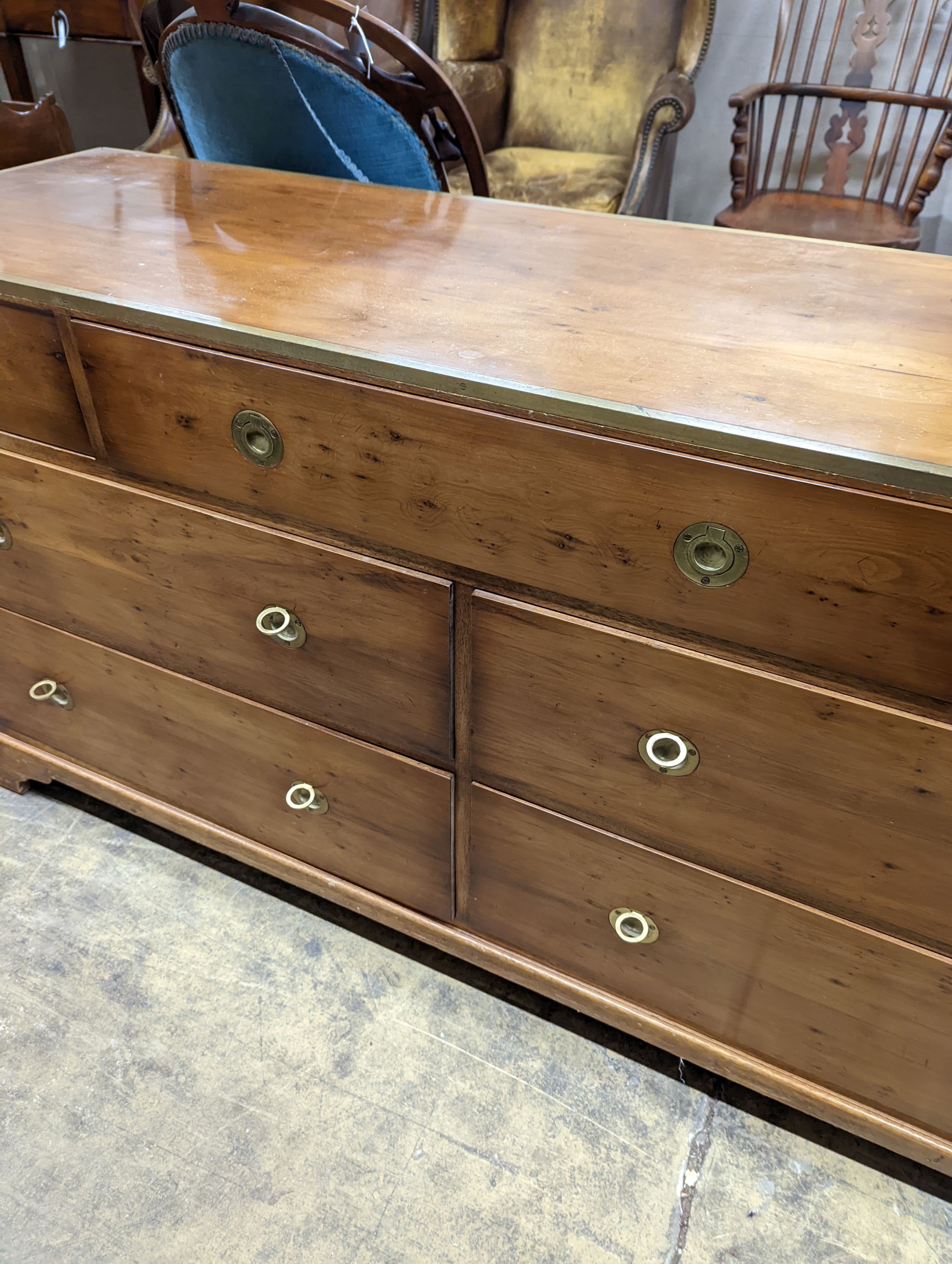 A reproduction brass mounted Military style yew veneered chest, width 153cm depth 46cm height 78cm
